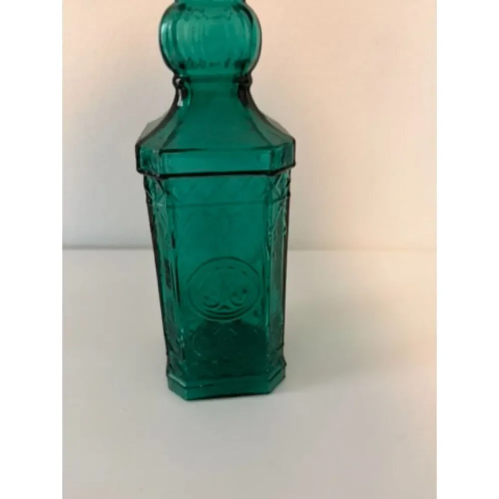 vtg emerald green glass decanter bottle with embossed sides and cork stopper